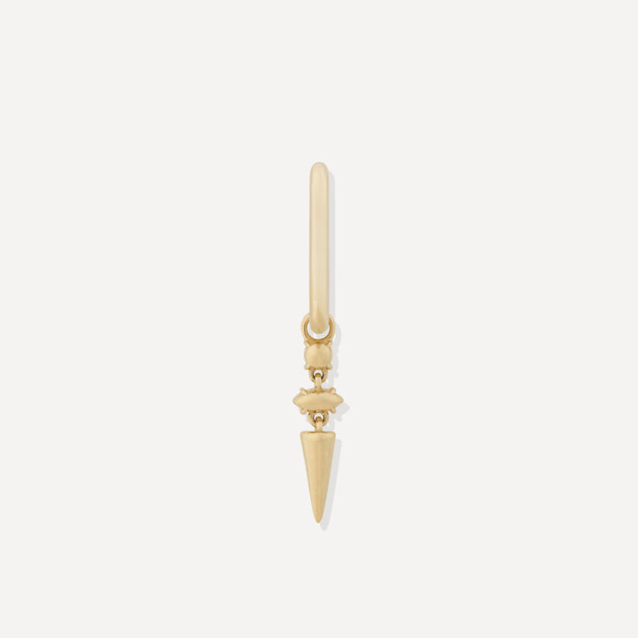 A single gold-colored hoop earring with a stacked design on a white background.
