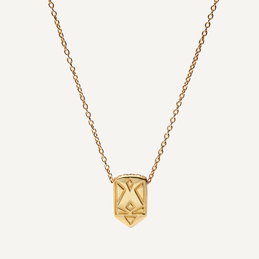 Image alt text: Affirmation Necklaces in 10K solid gold, featuring hidden pattern inspired by Ukrainian embroidery. Versatile and meaningful, perfect for solo wear or layering. Every purchase supports a cause