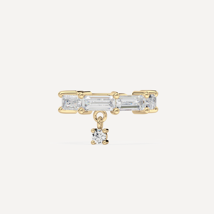 solid gold baguette diamond ear cuffs on a creamy white background by nadiya jewelry
