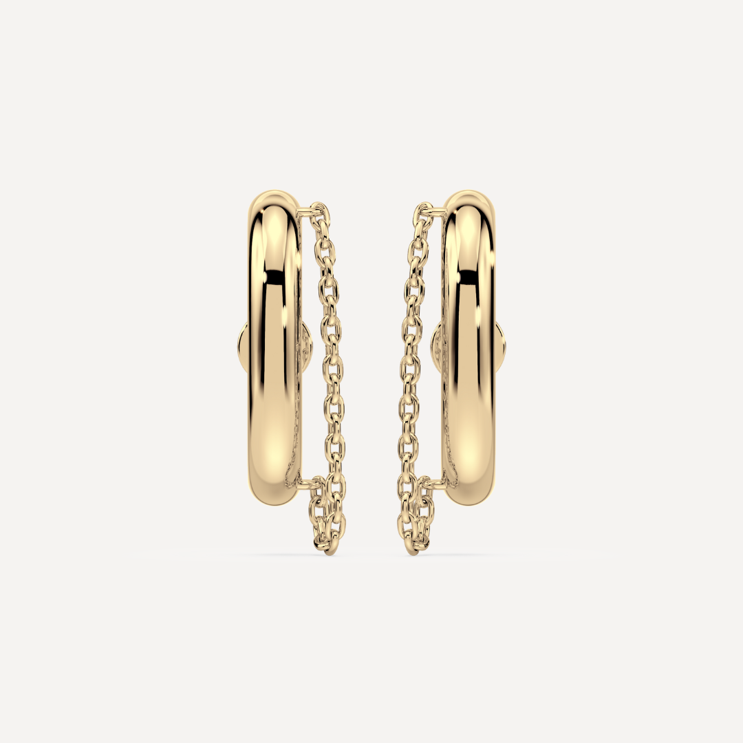 Solid gold ear suspender earrings with chain detail by Nadiya Jewelry on a white background