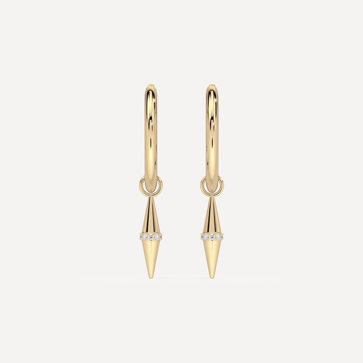 solid gold hoops with solid gold hoop charms and diamonds in a cone shape on white background by nadiya jewelry