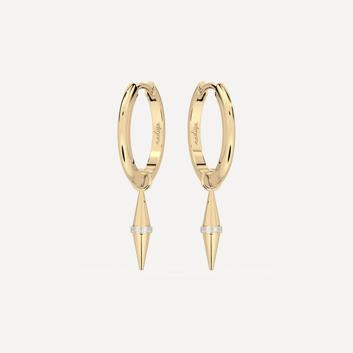 solid gold hoops with solid gold hoop charms and diamonds in a cone shape on white background by nadiya jewelry