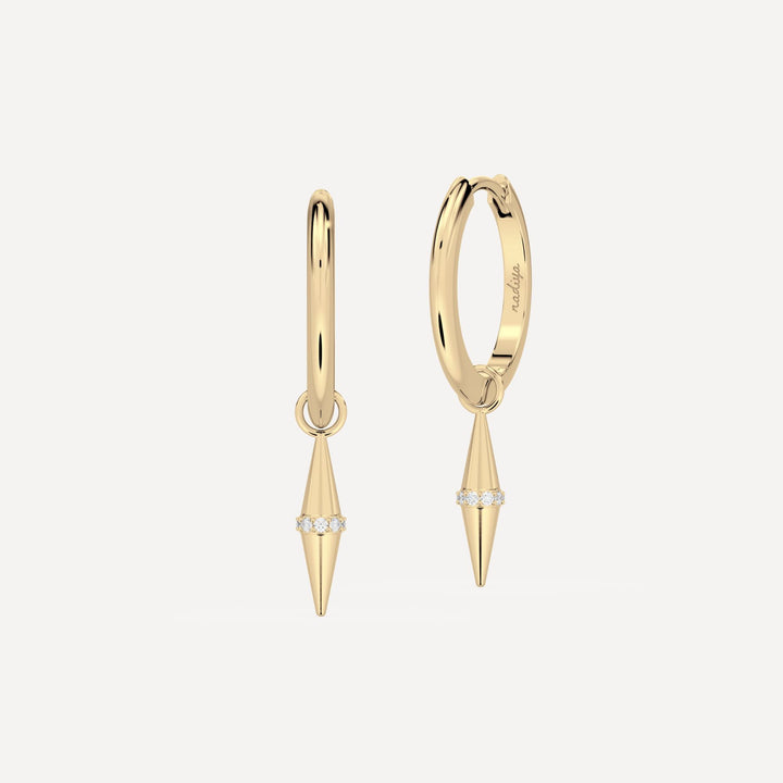 solid gold hoops with solid gold hoop charms and diamonds in a cone shape on white background by nadiya jewelry