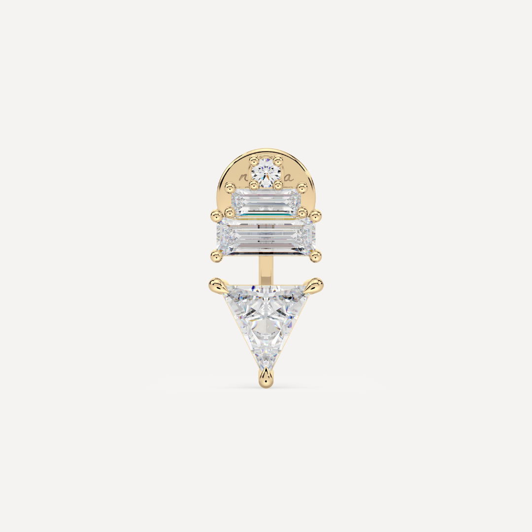 solid gold ladder ear jacket with lab grown diamonds. On the top there’s a round and two baguette diamonds and on the bottom there’s a trillion diamond on a creamy white background by nadiya jewelry