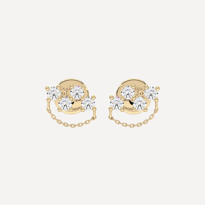 a solid gold earring with diamonds and chain detailing by nadiya jewelry 