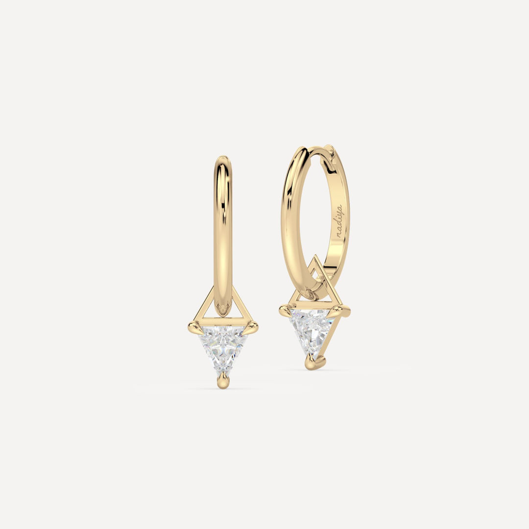 solid gold hoops with trillion diamond hoop charms on white background by nadiya jewelry 